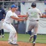 Lefties first baseman Nathan Chong, left, tags out Portlands Gabe Skoro before he can reach first in the third inning on Tuesday at Port Angeles Civic Field. (Keith Thorpe/Peninsula Daily News)