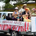 Ukuleles Unite! group strummed and sang its way down Lawrence Street in Saturdays Rhododendron Festival Grand Parade. The procession gathered 40 entries and hundreds of spectators to Uptown and downtown Port Townsend. (Diane Urbani de la Paz/Peninsula Daily News)