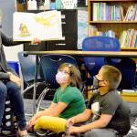 Chimacum Elementary summer school teacher Michelle Moseley reads What Do You Do with a Chance? to her students Tuesday morning. (Diane Urbani de la Paz/Peninsula Daily News)
