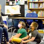 Chimacum Elementary summer school teacher Michelle Moseley reads What Do You Do with a Chance? to her students Tuesday morning. (Diane Urbani de la Paz/Peninsula Daily News)