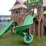 Four-year-old Jett Johnson of Port Angeles makes his way down a slide at the Dream Playground on Friday in Port Angeles. (Keith Thorpe/Peninsula Daily News)