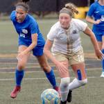 Peninsula Colleges Kyrsten McGuffey, right, outraces Edmonds Kaylinn Lawrence and dribbles downfield during a fall 2019 game at Wally Sigmar Field. McGuffey, a Port Angeles standout, returns for her sophomore season along with a host of talented Pirates. (Keith Thorpe/Peninsula Daily News)