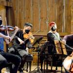 The barn at Trillium Woods Farm near Quilcene is the setting for free chamber concerts this summer, including last Sundays performance by, from left, James Garlick, Richard ONeill, Jeremy Denk and Ani Aznavoorian. This weekend will bring the final Concerts in the Barn at 2 p.m. Saturday and Sunday. Patrons who sit inside the barn must show proof of vaccination. (Diane Urbani de la Paz/Peninsula Daily News)