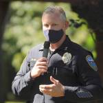 Sgt. Mike Hill of the Sequim Police Department thanks fellow essential workers at the Sequim-Dungeness Valley Chamber of Commerce's annual picnic and Citizen of the Year presentation. The chamber honored essential workers with its 2020 award. (Michael Dashiell/Olympic Peninsula News Group)