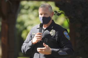 Sgt. Mike Hill of the Sequim Police Department thanks fellow essential workers at the Sequim-Dungeness Valley Chamber of Commerce's annual picnic and Citizen of the Year presentation. The chamber honored essential workers with its 2020 award. (Michael Dashiell/Olympic Peninsula News Group)