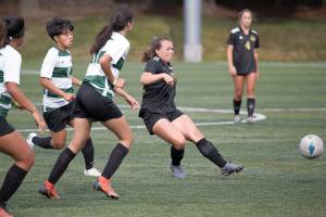 Peninsula College's Grace Johnson distributes the ball to a teammate while chased by three Chemeketa defenders during the Pirates' 11-0 victory Wednesday. Johnson, Chimacum High School's all-time leading goal scorer, netted her first collegiate hat trick in the win. (Rick Ross/Peninsula College Athletics)
