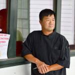 Shanghai Chinese Restaurant co-owner Jason Luong recently adopted a policy of checking the vaccination status of his customers. (Diane Urbani de la Paz/Peninsula Daily News)