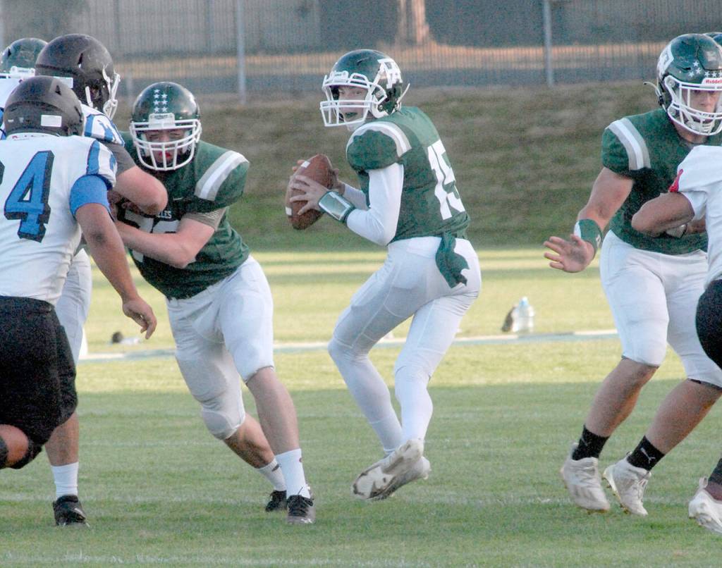 Keith Thorpe/Peninsula Daily News Port Angeles quarterback Josiah Pennington fades back to pass during Friday nights game against East Jefferson at Port Angeles Civic Field.
