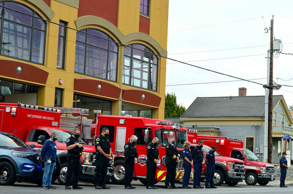 Saturday at 8:46 a.m., East Jefferson Fire & Rescue and Port Townsend Police Department crew members bowed their heads for one minute of silence. A brief ceremony outside the EJFR station at Lawrence and Harrison streets honored the first responders who served at the sites attacked on Sept. 11, 2001. (Diane Urbani de la Paz/Peninsula Daily News)