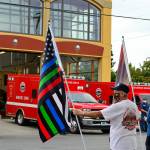 Max Plattner of Port Townsend brought several 9/11 remembrance flags to the East Jefferson Fire & Rescue station Saturday morning. (Diane Urbani de la Paz/Peninsula Daily News)
