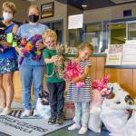 Holding animals sewn by Sequims Fiber Arts Neighborhood Group are, from left, Monica Dixon of the Sequim group, which is part of the American Sewing Guild; Tessa Jackson, director of the Sequim unit of the Boys & Girls Clubs of the Olympic Peninsula; Nick, 5; and Josie, 4; of Great Futures Preschool, housed at the Sequim unit. (Emily Matthiessen/Olympic Peninsula News Group)