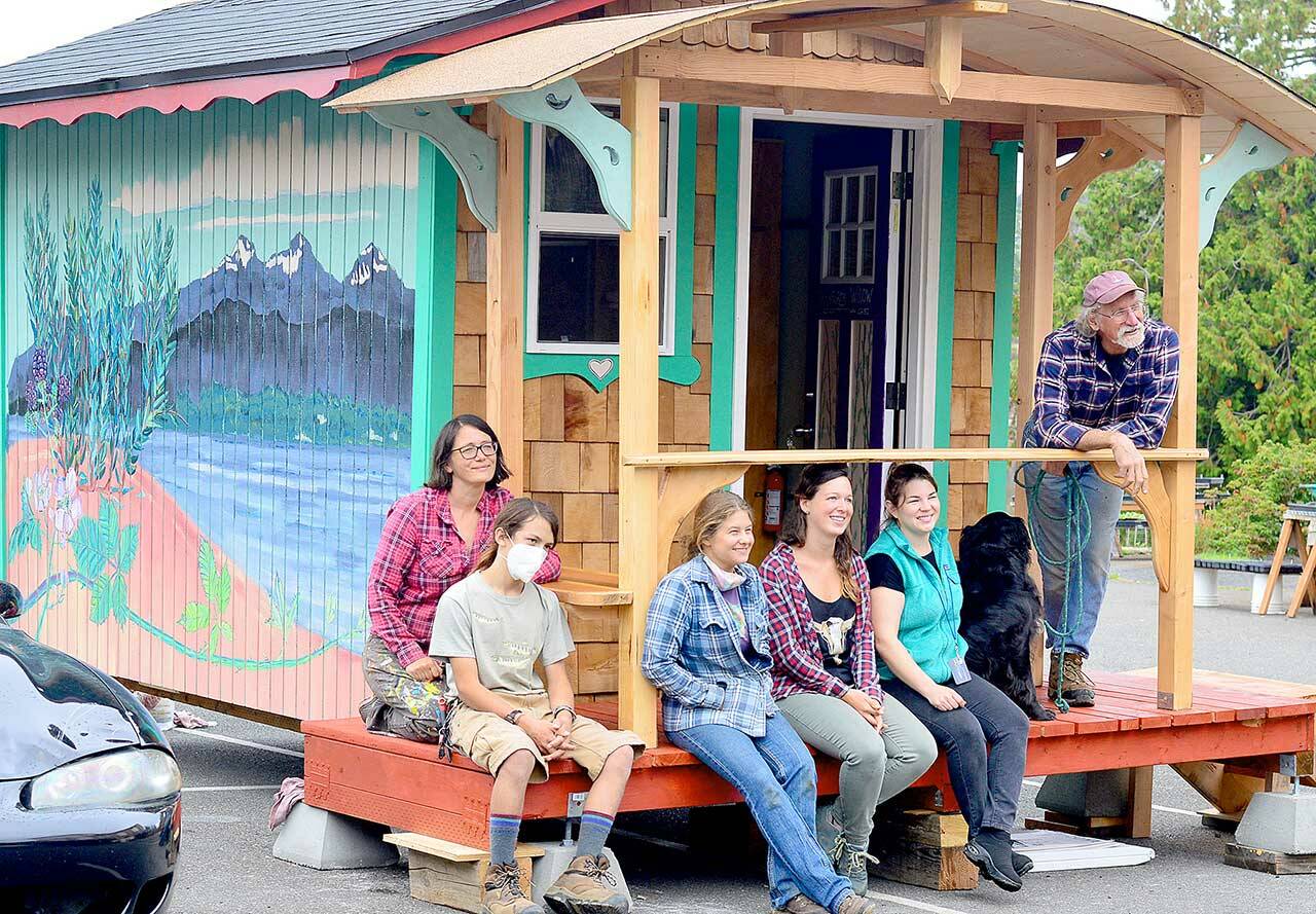 The crew behind the newest Bayside Housing-Community Boat Project tiny home includes, from left, Danielle Fodor, Raul Sierra, Lena Morton, Gillian Kenagy, Shanell Rosenfeld and Capt. Wayne Chimenti. (Diane Urbani de la Paz/Peninsula Daily News)