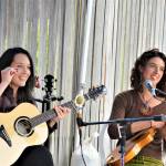 Micaela Kingslight, left, and Samara Jade are two-thirds of Three Wheels Turning, pictured during their May gig at the Keg & I in Chimacum. The trio, which also includes Aimée Ringle, will play from 6 p.m. to 8 p.m. this evening at Finnriver Farm & Cidery in Chimacum. (Diane Urbani de la Paz/Peninsula Daily News)