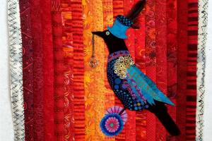 "The Covid Corvid" by Peggy St. George will be displayed in the Bumblebunching – Warped, Twisted, & Imperfect” exhibit that is part of the North Olympic Fiber Arts Festival.
