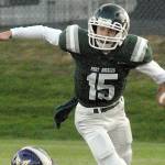 Keith Thorpe/Peninsula Daily News
Port Angeles quarterback Parker Nickerson gets tripped up on a short run by North Kitsap's Benen Lawler on Friday night at Port Angeles Civic Field.