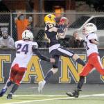 Spartan Ryan Rancourt (13) clutches a Logan Olson pass between two Titan defenders Friday night at Spartan Stadium where Forks defeated Pe Ell-Willapa Valley 22 to 21 in a thriller. Photo by Lonnie Archibald.
Spartan Ryan Rancourt (13) clutches a Logan Olson pass between two Titan defenders Friday night at Spartan Stadium where Forks defeated Pe Ell-Willapa Valley 22 to 21 in a thriller. (Lonnie Archibald/for Peninsula Daily News)