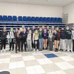 The Port Angeles and Sequim volleyball teams celebrate their showings at the Monarch Volleyball Tournament held in Longview this weekend.