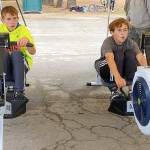 Lukas Teague of Port Angeles and Grady White of Port Townsend battle it out on the second of three events in the Little Hurt Triathlon on Sunday at Lincoln Park in Port Angeles.