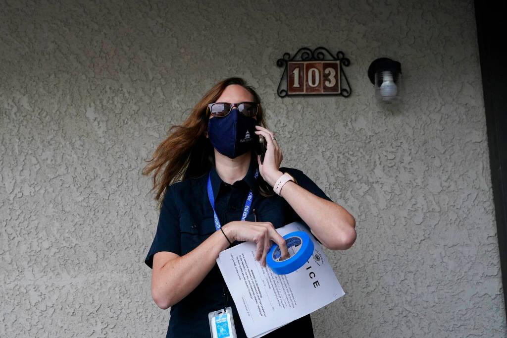 Pima County Constable Kristen Randall arrives at an apartment complex to speak to a rental resident about their eviction case on Sept. 24 in Tucson, Ariz. (AP Photo/Ross D. Franklin)