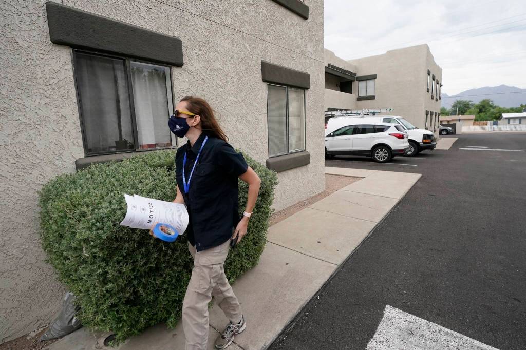 Pima County Constable Kristen Randall arrives at an apartment complex to speak to a rental resident about their eviction case on Sept. 24 in Tucson, Ariz. (AP Photo/Ross D. Franklin)