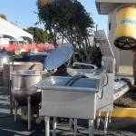 Keith Thorpe/Peninsula Daily News
Quinton Chastain of Olympia carries an insulated barrel on Thursday while setting up an outdoor kitchen for this weekend's Dungeness Crab and Seafood Festival near the Port Angeles waterfront. The three-day festival begins today