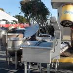Quinton Chastain of Olympia carries an insulated barrel on Thursday while setting up an outdoor kitchen for this weekends Dungeness Crab and Seafood Festival near the Port Angeles waterfront. (Keith Thorpe/Peninsula Daily News)