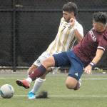 Peninsulas Jonathan DeMotta, left, tries to avoid a tackle from Whatcoms Inseong Park on Saturday at the Wally Sigmar Sports Complex. (Keith Thorpe/Peninsula Daily News)
Peninsulas Jonathan DeMotta, left, tries to avoid a tackle from Whatcoms Inseong Park on Saturday at the Wally Sigmar Sports Complex. (Keith Thorpe/Peninsula Daily News)