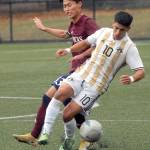 Peninsulas Fernando Tavares, front, cuts off a pass intended for Whatcoms Donghyeon Kim on Saturday in Port Angeles. (Keith Thorpe/Peninsula Daily News)
