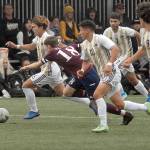 Peninsulas Hayahide Sakamoto, left, leads the charge downfield followed by Whatcoms Thomas Watson and teammates, from left, Fernando Tavares, Jonathan Demotta and Juan Carlos Hernandez on Saturday at Wally Sigmar Field. (Keith Thorpe/Peninsula Daily News)