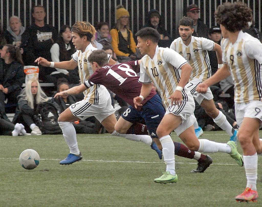 Peninsulas Hayahide Sakamoto, left, leads the charge downfield followed by Whatcoms Thomas Watson and teammates, from left, Fernando Tavares, Jonathan Demotta and Juan Carlos Hernandez on Saturday at Wally Sigmar Field. (Keith Thorpe/Peninsula Daily News)
