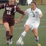 Peninsulas Shayanne Chang tries to evade Whatcoms Keylie Hershey on Saturday in Port Angeles. (Keith Thorpe/Peninsula Daily News)