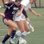Whatcoms Alana Sullivan, left, and Peninsulas Kascia Muscutt battle for ball control on Saturday in Port Angeles. (Keith Thorpe/Peninsula Daily News)
