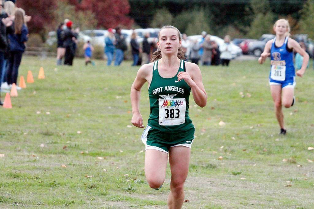Port Angeles freshman Zakara Braun runs during a cross country meet at Battle Point Park in Bainbridge on Wednesday. (Mark Krulish/Kitsap News Group)