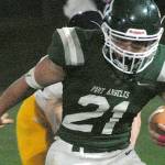 Keith Thorpe/Peninsula Daily News
Port Angeles' Daniel Cable escapes the Bainbridge defense on Friday night at Port Angeles Civic Field.