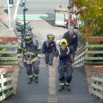 Stairclimbers, from left, Tim Davis, Margie Brueckner, Matt Aston and Esther McKellar of the Port Angeles Fire Department, practice ascending the Laurel Street Stairs above downtown Port Angeles on Saturday in preparation for next springs 31st annual LLS Firefighter Stairclimb on March 13 at the Columbia Center in downtown Seattle. The climb, a benefit for the Leukemia & Lymphoma Society, requires firefighters and emergency personnel to make a timed ascent of the 788-foot skyscrapers 69 flights of stairs to help fund cancer research. (Keith Thorpe/Peninsula Daily News)