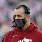 Washington State coach Nick Rolovich watches during the first half of the team's NCAA college football game against Stanford, Saturday, Oct. 16, 2021, in Pullman, Wash. (AP Photo/Young Kwak)