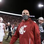 Washington State coach Nick Rolovich walks on the field after the teams NCAA college football game against Stanford, Saturday, Oct. 16, 2021, in Pullman, Wash. Washington State won 34-31. (AP Photo/Young Kwak)