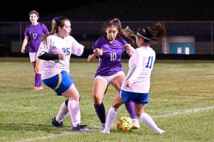 Michael Dashiell/Olympic Peninsula News Group
With teammate Kaia Lestage (left) looking on, Sequim's Jennyfer Gomez (10) vies for possession in the Wolves' 6-0 win Tuesday night against visiting Bremerton.