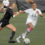 Peninsulas Miya Clarke, right, outpaces Skagit Valleys Ahsley Thomas during Wednesdays match in Port Angeles. (Keith Thorpe/Peninsula Daily News)