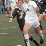 Keith Thorpe/Peninsula Daily News
Peninsula's Millie Long, front, tries to evade Skagit Valley's Brianna Yamada on Wednesday as  Peninsula's Krysten McGuffey, rear left, and Skagit Valley's Sierrah Esson, right, keep pace.