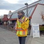 Ham radio operator Kathleen Reiter, training coordinator for Amateur Radio Emergency Services, relays radio messages outside the county courthouse during Thursdays Great ShakeOut, an international drill to practice how to drop, cover and hold in the event of an earthquake. In Clallam County, numerous schools and other agencies practiced what to do in an emergency. Included in the drill was the sounding of tsunami sirens across the state. (Keith Thorpe/Peninsula Daily News)
