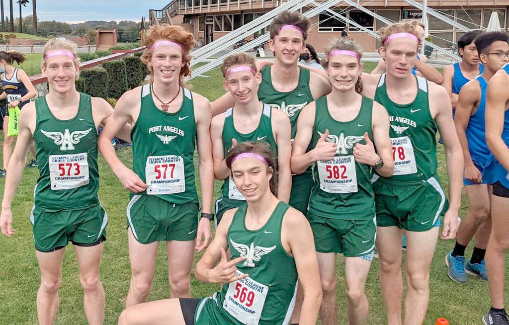 The Port Angeles varsity boys cross country team won the Olympic League Cross Country Championship on Thursday at The Cedars at Dungeness Golf Course. The Roughriders will compete as a team at the West Central District Championships at Chambers Bay next Saturday. Team members are, from left, Josh Gavin, Jack Gladfelter, Langdon Larson, Naaman McGuffey, Kowen Kasten, Jason Gladfelter, Max Baeder in front. (Rodger Johnson/Port Angeles Cross Country)