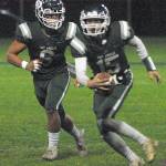 Port Angeles Parker Nickerson, right, rushes with the ball with protection from teammate Jaziel Livingston on Friday at Port Angeles Civic Field. (Keith Thorpe/Peninsula Daily News)