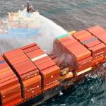 Crews keep surrounding containers and the hull of the MV Zim Kingston cool while fires continue to smoulder aboard the ship. (Canadian Coast Guard/Twitter)
