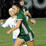 Keith Thorpe/Peninsula Daily News
Port Angeles' Lily Sanders, right, slips past Bremerton's Marisol Popoca-Pablo on Thursday night in Port Angeles.