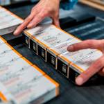 This October 2021 photo provided by Pfizer shows boxes of kid-size doses of its COVID-19 vaccine. The U.S. moved a step closer to expanding vaccinations for millions more children as a panel of government advisers on Tuesday, Oct. 26, endorsed kid-size doses of Pfizer's shots for 5- to 11-year-olds. (Pfizer via AP)