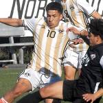 Keith Thorpe/Peninsula Daily News
Peninsula's Fernando Tavares, center, fightrs off a tackle by Everett's Carlos Rodriguez as Tavares' teammate, Juan Carlos Hernandez, looks on during Saturday's match at Wally Sigmar Field in Port Angeles.