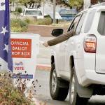 A voter drops off his ballot Monday morning at the Clallam County Courthouse in Port Angeles. More than 31 percent  31.37 percent  of the 57,150 ballots mailed to registered voters had been returned as of Monday, according to the Clallam County elections office. Ballots must be postmarked by today or deposited at one of seven drop boxes in the county tonight by 8 p.m. Initial results will be posted at cmg-northwest2.go-vip.net/peninsuladailynews. Look for more coverage in Thursdays print editions. (Dave Logan/for Peninsula Daily News)