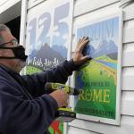 Outside the float barn, Guy Horton hangs up this years royalty floats sign. I thought this year was an amazing float, he said. It was his 14th and final float, he said as he plans to focus more on work and family- and self-care. (Matthew Nash/Olympic Peninsula News Group)