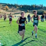 Port Angeles Max Baeder keeps pace with Sequims Colby Elofson at the District 3 cross-country championships this weekend at Chambers Bay. Both Baeder and Elofson will be going to the 2A state cross-country meet. (Courtesy of Rodger Johnson)